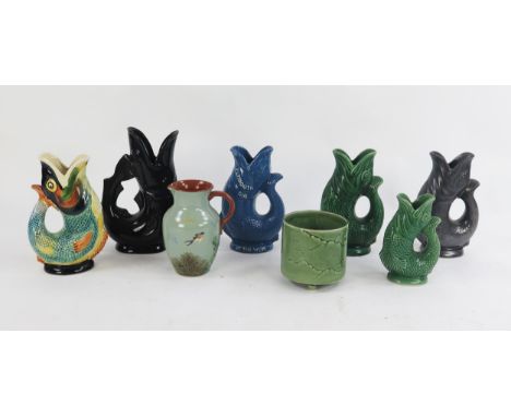 A Dartmouth pottery glug glug jug "Plymouth Gin of the West,  together with five other examples, a Dartmouth pottery jardiniè
