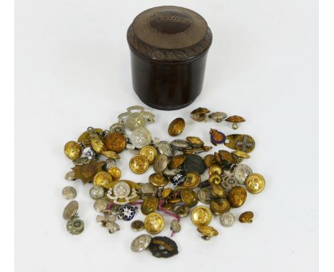 A collection of British naval and army buttons St Johns Ambulance buttons contained in a Bakelite tobacco jar and cover. 