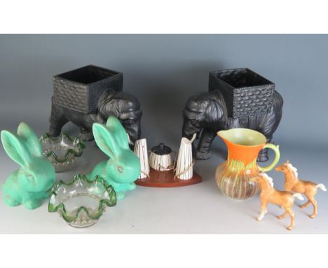 A 1960's condiment stand with pottery condiments, two Sylvac style bunnies, two Beswick ponies, a pair of Elephant pottery ja