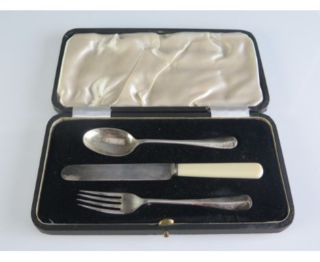 A George VI silver christening set, maker Atkin Brothers, Sheffield, 1942, includes fork, spoon, knife with ivorine handle, c