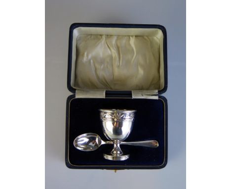 A George V silver egg cup, maker's mark worn Birmingham, 1918, together with a spoon, Birmingham, 1919, 35gms, 1.15ozs.