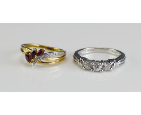 A 10K White Gold and Diamond Three Stone Ring (0.5ct, size N, stamped 1/2TW 10K, size N, 2.95g) and a 9ct gold, ruby and diam
