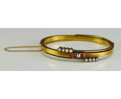 An Antique Russian 14ct Gold, Ruby and Split Pearl Hinged Bangle with safety chain, c. 16.5cm circumference (6.5"), 56 zolotn