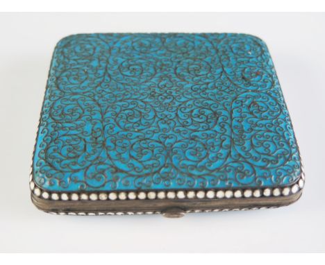 An Imperial Russian silver and enamel cigarette case, maker HC, Moscow, 1894, of square outline with powder blue enamel decor