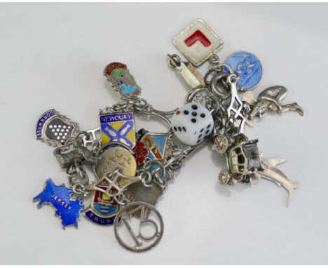 A Silver and Enamel Charm Bracelet with a glass die, 35.4g