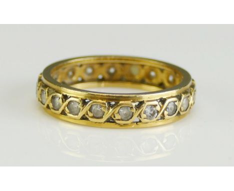 A Precious Yellow Metal and Gem Set Eternity Ring, 4.3mm wide band, size M.5, stamped 18, KEE tests as 18ct, 3.19g.  UNLESS O
