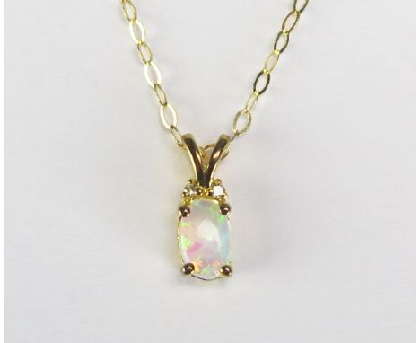 An opal and diamond set pendant mounted in a 9ct gold mount and chain, length of chain 222mm.