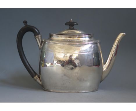 A George III silver teapot, maker Robert Jones II, London, 1798, monogrammed, of oval form, with banded decoration, 26cm long