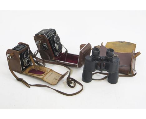 Yashica-D twin reflex camera, contained in a stitched leather case, a Ferrania twin reflex camera and Dr. Wohler Kasser Binoc