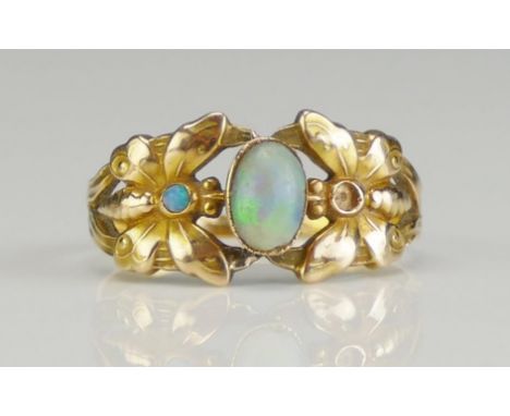 An Opal 'Butterfly' Ring in a high carat precious yellow metal setting, size O. 2.11g. One stone missing