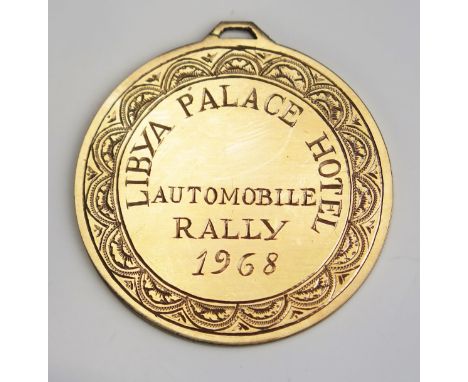 A Libya Palace Hotel Automobile Rally 1968 Medallion, 43.9mm diam., KEE tests as 14ct, 24g. UNLESS OTHERWISE STATED, THE KEE 