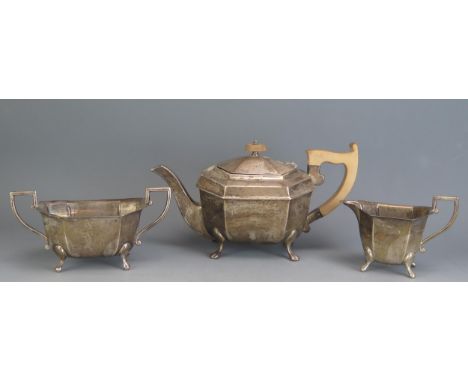 A George VI silver tree-piece tea service, maker Viners Ltd, Sheffield, 1939, of lozenge-shaped outline raised on swept claw 