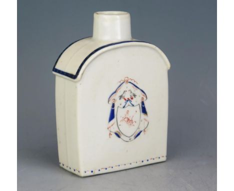 An 18th century Chinese armorial porcelain tea caddy, crested, of arched outline, (lacks stopper), 12.5cm high.