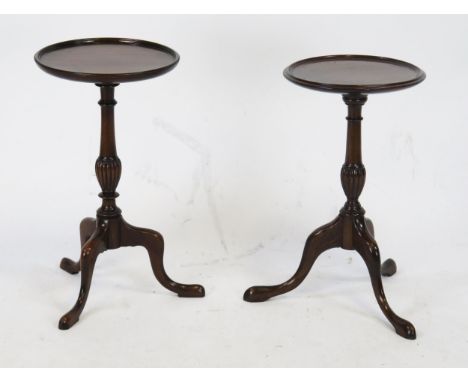 A pair of Georgian style mahogany wine tables, with moulded circular tops on knopped stems and tripod feet,  26cm diameter.