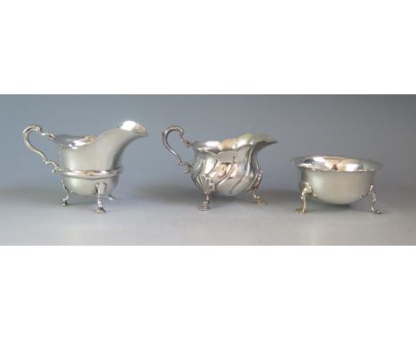 A mixed collection of silver wares, various makers and dates, includes a sugar basin and two cram jugs, total weight of silve