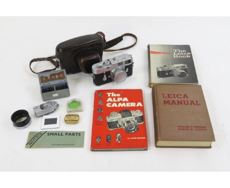 A Leica M2 35mm camera, serial No 1011876, with Elmar f=5cm 1:2.8 lens, together with accessories including light meter, filt