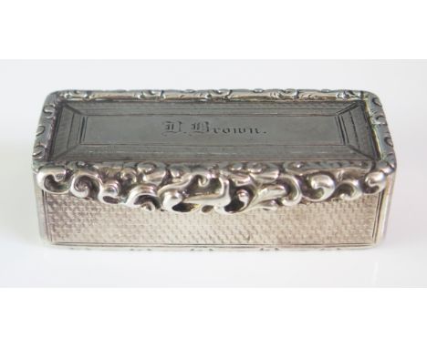 A George IV silver snuff box, maker Edward , Birmingham, 1829, inscribed, of rectangular outline, with scrolling border and r