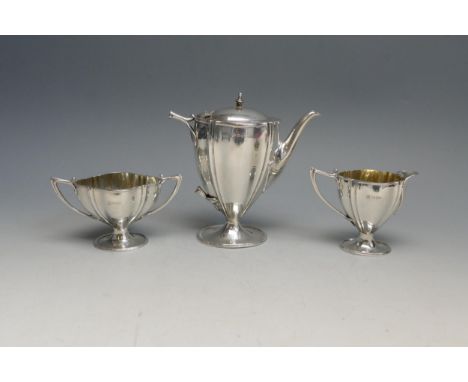 An Edward VII silver three-piece bachelors coffee service, maker James Deakin &amp; Sons, Chester, 1904, of oval tapering for