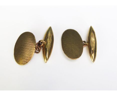 A Pair of 9ct Gold Cufflinks with engine turned decoration, hallmarked, 4g, cased