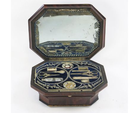 A 19th century walnut musical sewing box, of cartouche-shaped outline, the hinged lid with mirror to the interior, enclosing 