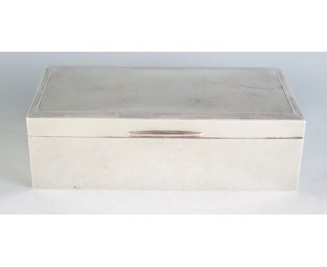 A George V silver cigarette box, maker Walker &amp; Hall, Birmingham, 1911, of rectangular outline with engine turned decorat