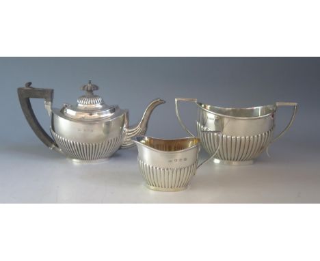 A mixed collection of silver  half reeded tea wares, various makers and dates, includes teapot, sugar basin and cream jug, to