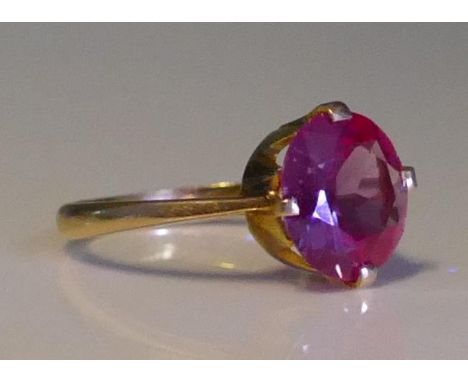 An Alexandrite? Colour Change Gem Set Ring in a high carat precious yellow metal setting, 10.8mm stone, size N, KEE tests as 