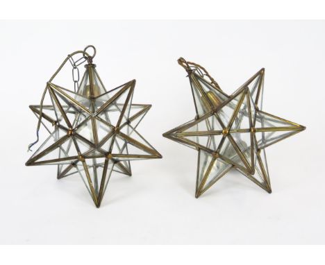 A pair of brass framed Moravian star-shaped pendant ceiling lights, with loop suspension ring, 40cm high.