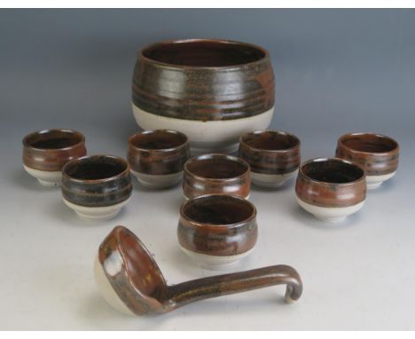 A Colin Pearson Studio Pottery Punch Bowl with ladle and eight coupes, c. 20cm diam.