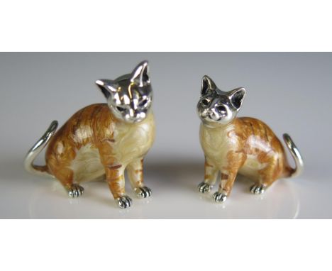 two novelty enamel and silver mounted models of cats, each 3cm high.