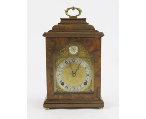 A reproduction walnut cased bracket clock, with caddy top, the 10cm dial with silvered chapter ring, the twin train movement 