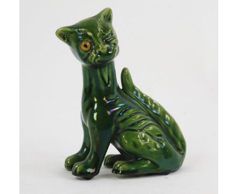 An Aller Vale pottery winking cat, with inset glass eye, and green glaze, 16.5cm high.