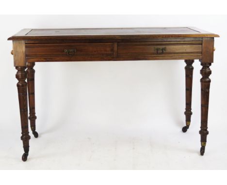 A Victorian mahogany writing table, the rectangular top with tooled leather inset writing surface, with two frieze drawers, r