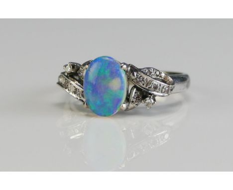 A 14K White Gold, Opal and Diamond Ring, 8.77x6.3mm principal stone, size L, stamped 14K, 3.63g