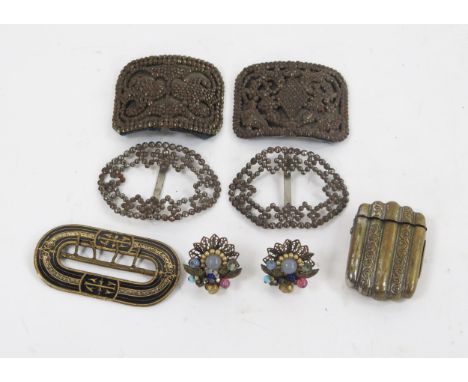 Two pairs of steel cut shoe buckles, an enamel buckle brass vesta case and a pair of ear studs.