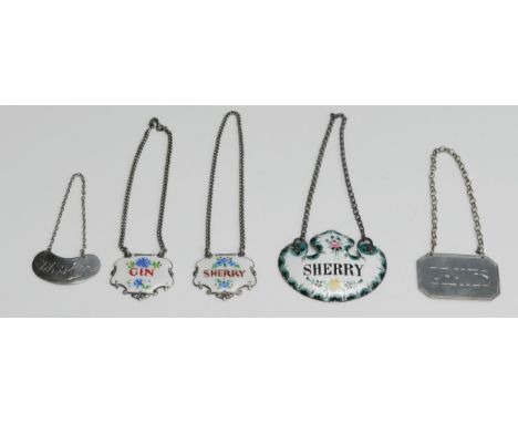 A pair of silver and enamel spirit labels, and three other  labels, various makers and dates.