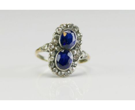 An Antique Sapphire and Old Cut Diamond Ring in a precious yellow and white metal setting, c. 6x4.6mm principal stone, size K