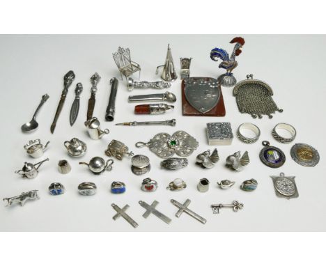 A collection of silver and other novelties, including charms, patch box, purse etc