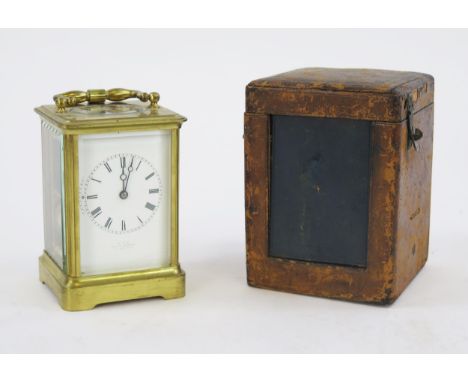 A French lacquered brass carriage clock, with 6.5cm roman dial, the movement with lever, platform escapement striking the hou