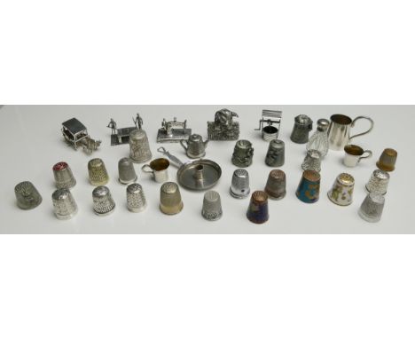 A collection of silver and plated thimbles, white metal model of billiards players, pig, oxen drawn sledge, miniature sewing 