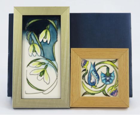 A Moorcroft pottery panel snowdrop pattern, in a silvered frame, 20.5 x 9.5cm. and a Moorcroft William De Morgan tile, framed