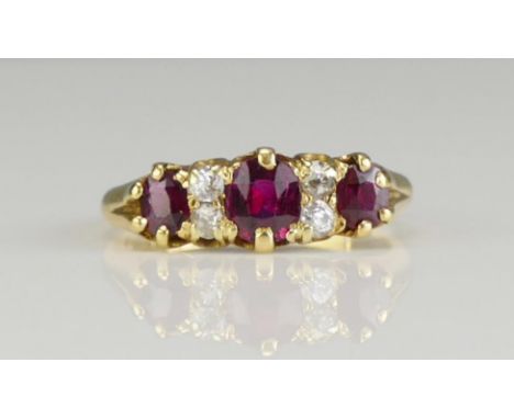 A Victorian 18ct Gold, Ruby and Old Cut Diamond Seven Stone Ring, c. c. 4.9c4.5mm principal stone, size K.5, Chester 1892, 3.