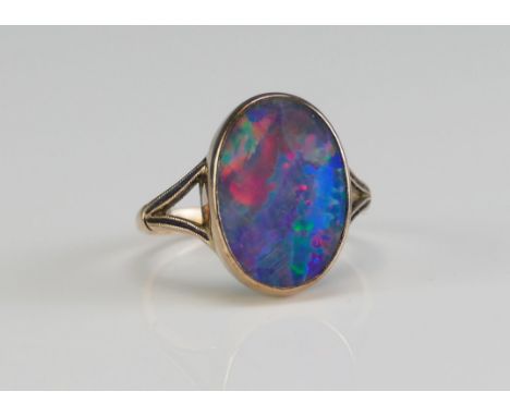 A 9ct Gold and Opal Doublet Ring, size K.5, stamped 9CT, 2.49g