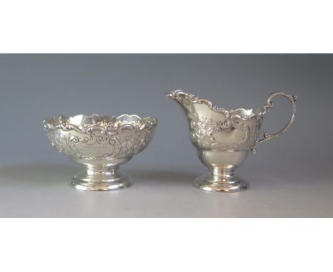 An Edward VII silver cream jug and sugar basin, maker Horace Woodward &amp; Co, London, 1906, inscribed, of circular form wit