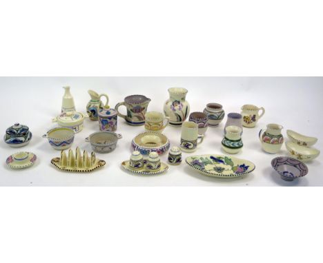 A collection of assorted Honiton pottery including toast rack, vases, bowls, dishes, cream jugs, condiments etc.