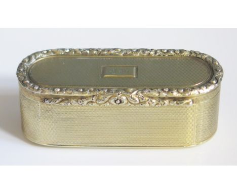 A George III silver gilt snuff box, maker Charles Rawlings, London, 1819, initialled, of oval form with engine turned and cas