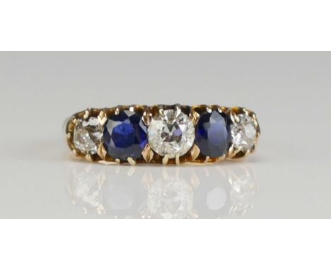 A Sapphire and Diamond Five Stone Ring in a high carat precious yellow metal setting, early 20th century, c. 4.45mm principal