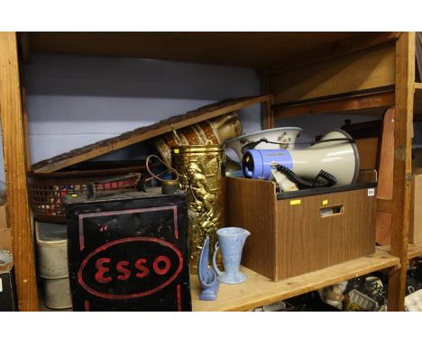 Shelf including a megaphone, Shell petrol can etc.