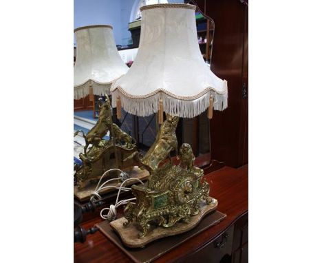 A brass mantle clock and lamp on marble base