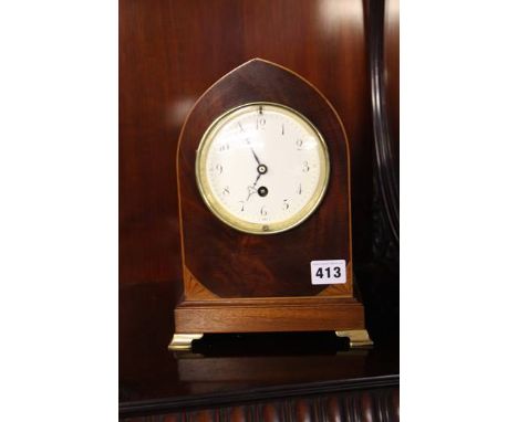 Mahogany mantle clock on brass bracket feet
